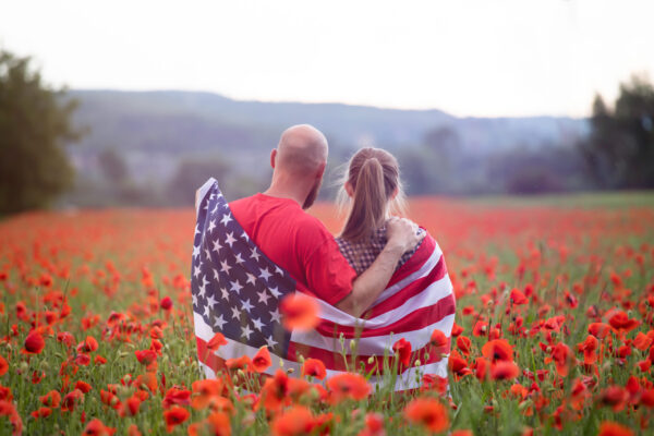 couple holding the american flag on the 4th of jul 2021 08 28 08 59 04 utc scaled 1