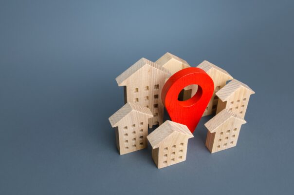 wooden houses and a red location pin 2022 11 09 06 41 09 utc scaled